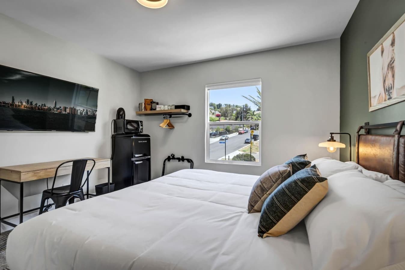 The main bedroom has the work station, TV, Fridge, Microwave and of course the King Bed.