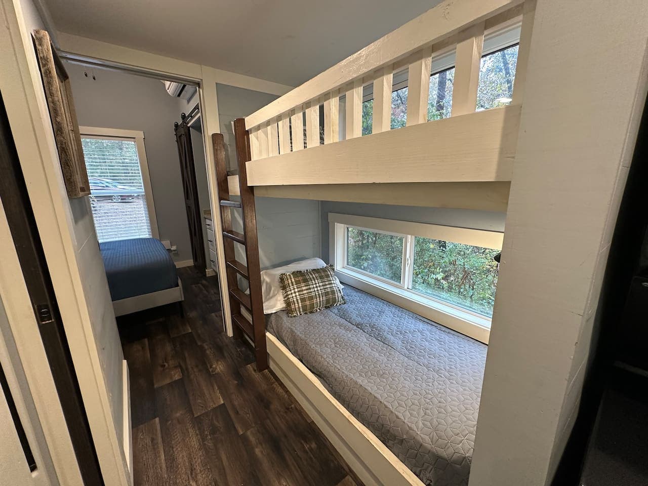 A cozy bunk bed tucked in the hallway right outside the master bedroom.