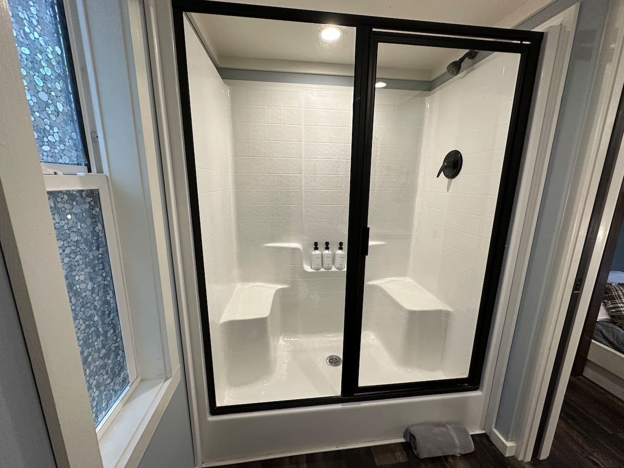 A cozy full bath with a walk-in shower for easy relaxation.