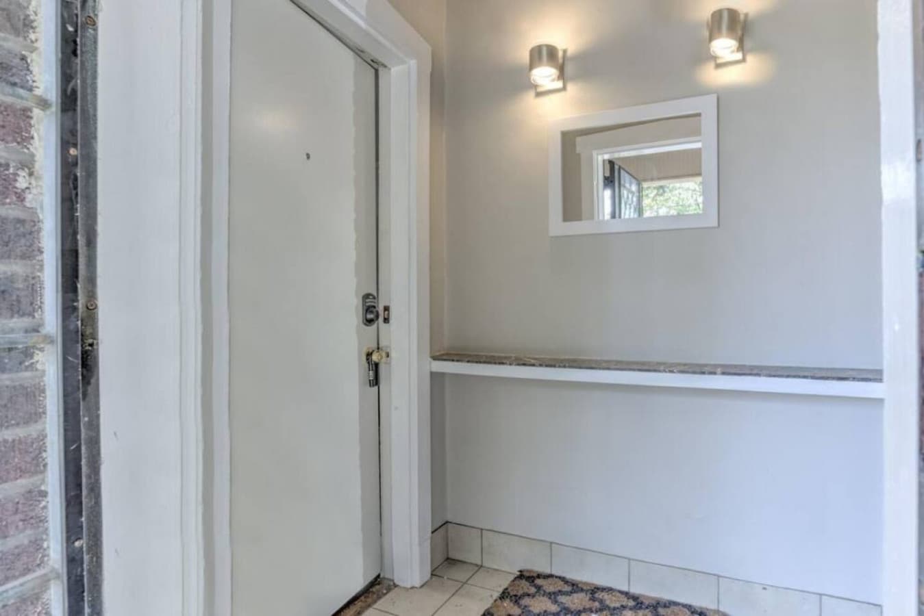 Entrance/Foyer once you enter the main metal storm door. Door A is on the left and door B is to the right.