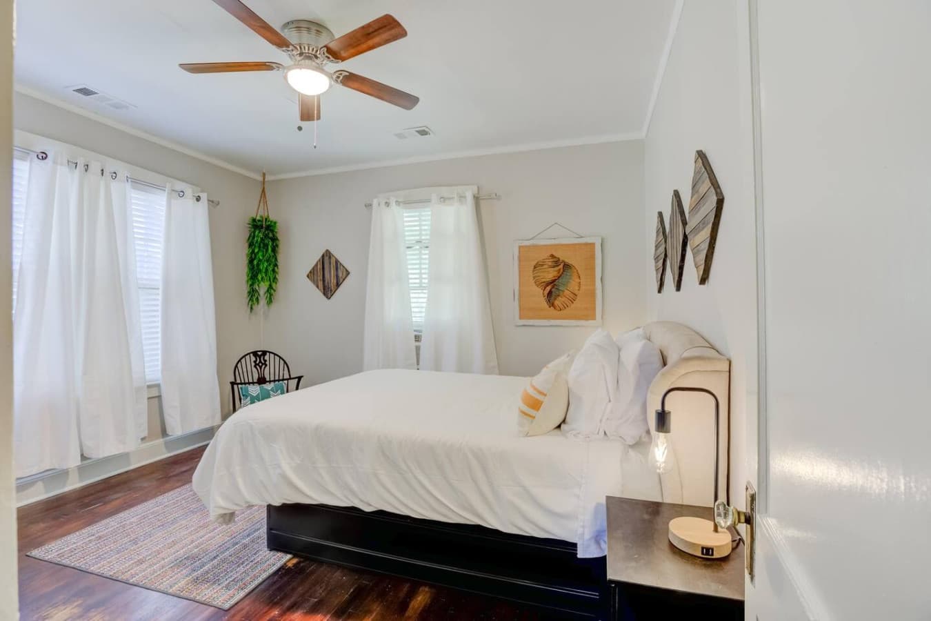 Soft sheets, calm vibes, and a queen bed ready for real rest.