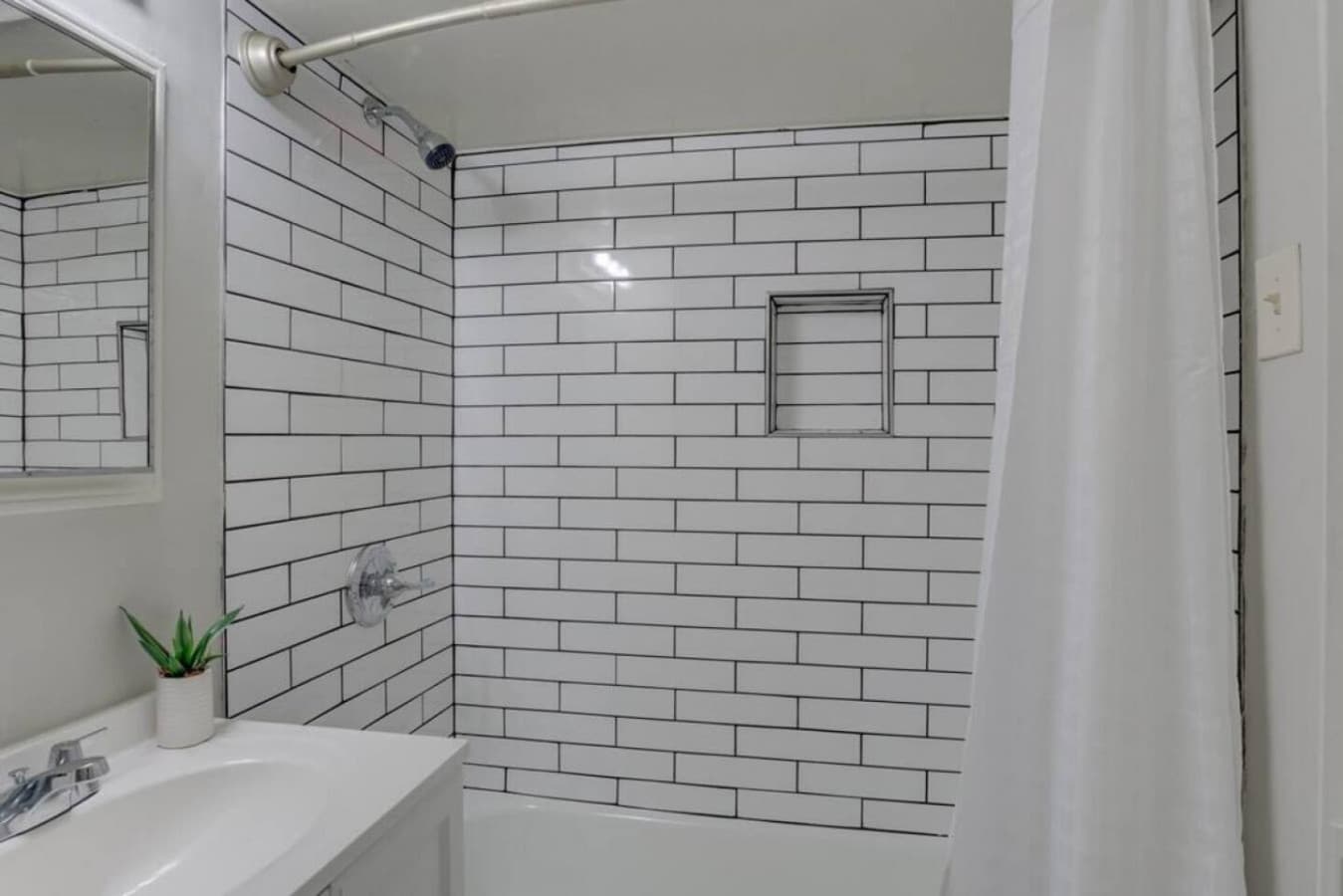 Enjoy a quick rinse or a warm soak in the shower–tub combo.