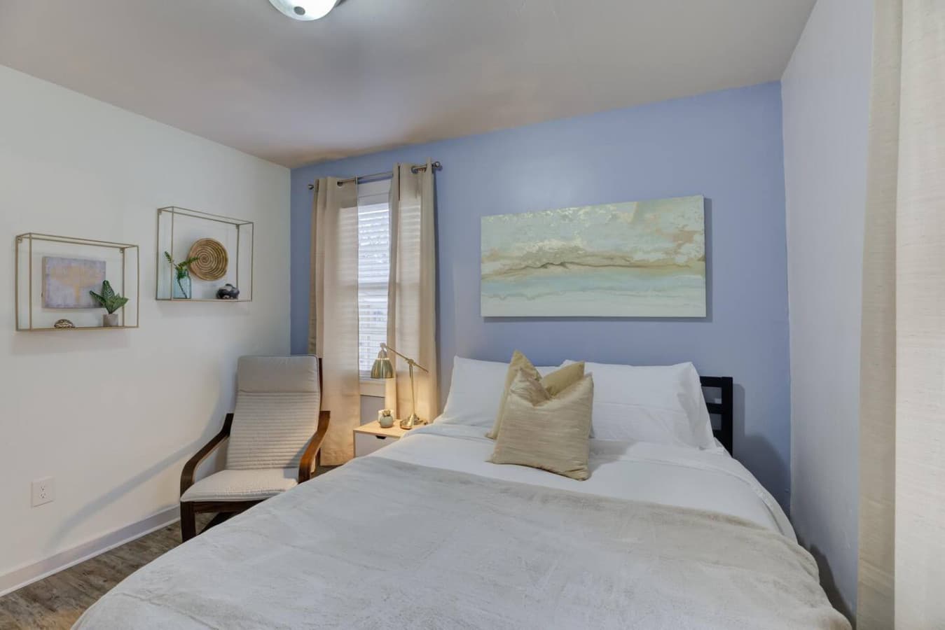 Sleep easy in this bright and comfortable queen bedroom.