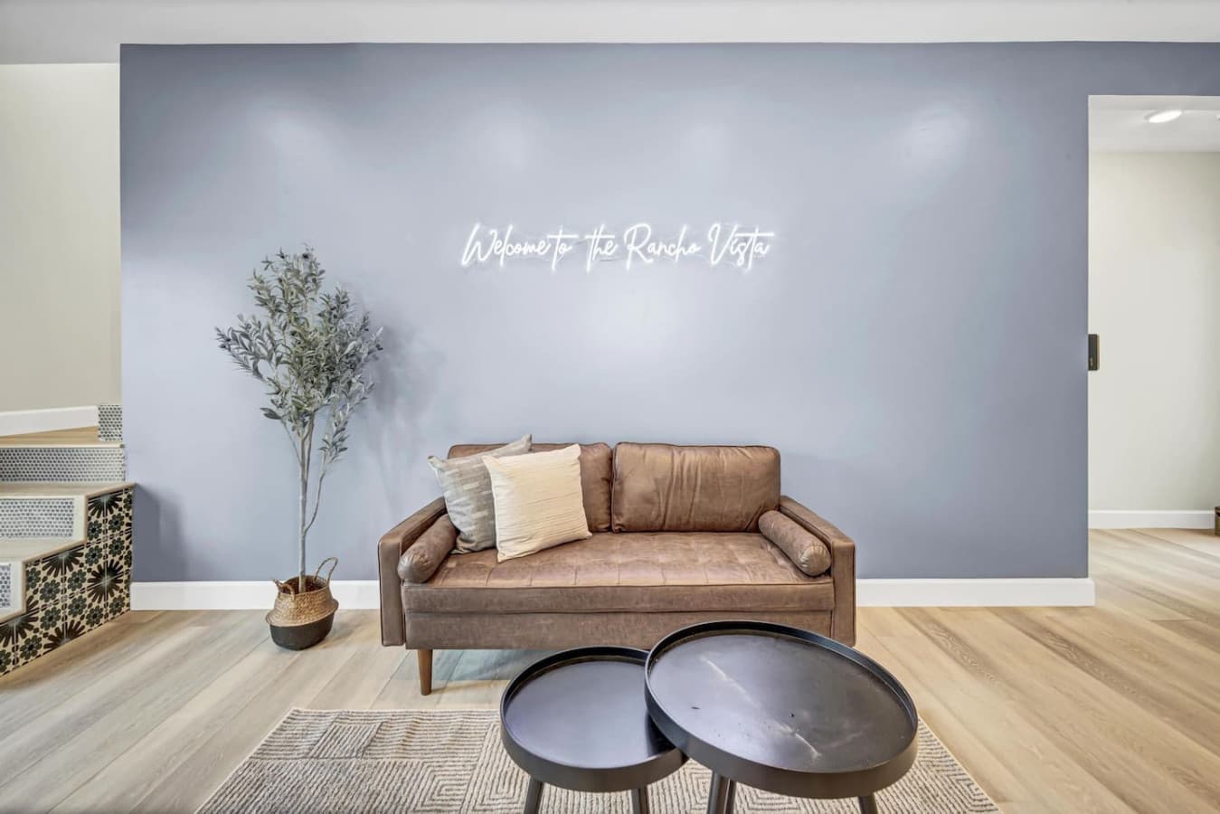 Sit back and relax in the cozy shared lobby—featuring a sleek leather couch, warm ambiance, and even board games for a little extra fun!