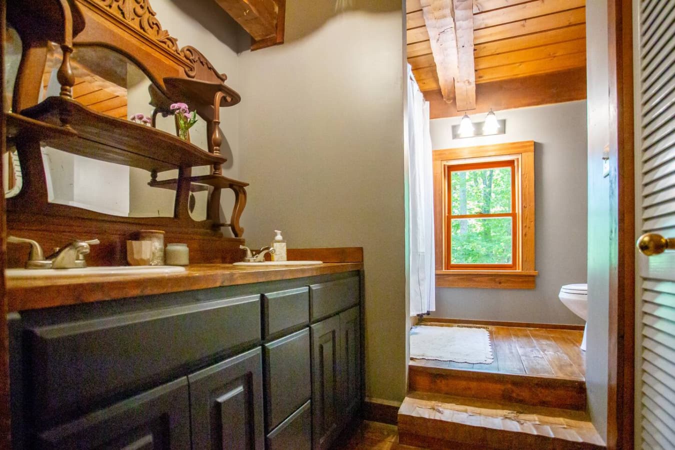 A stunning rustic vanity with two sinks where timeless wood meets practical elegance.
