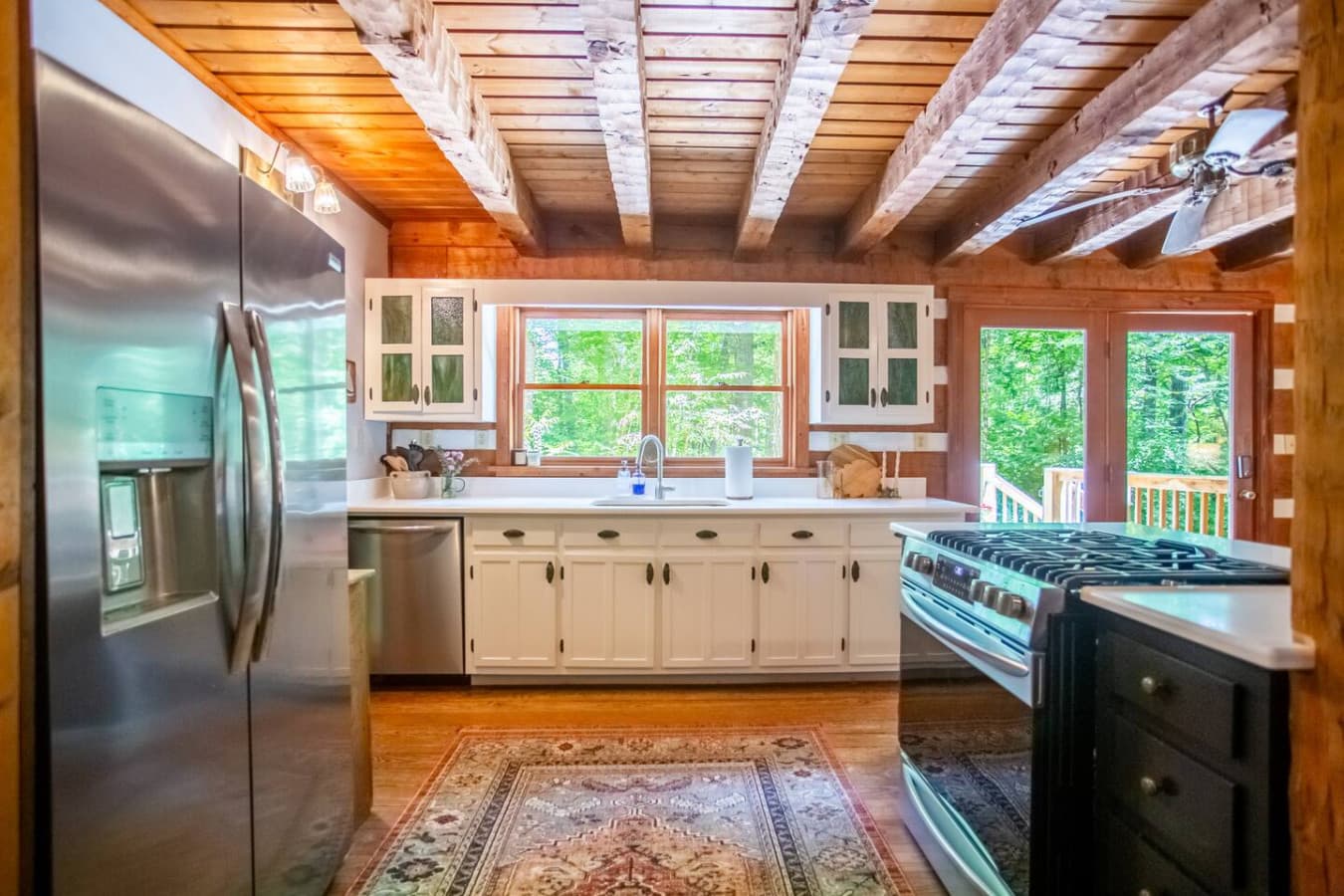Warm wood tones and modern appliances make cooking a joy here.