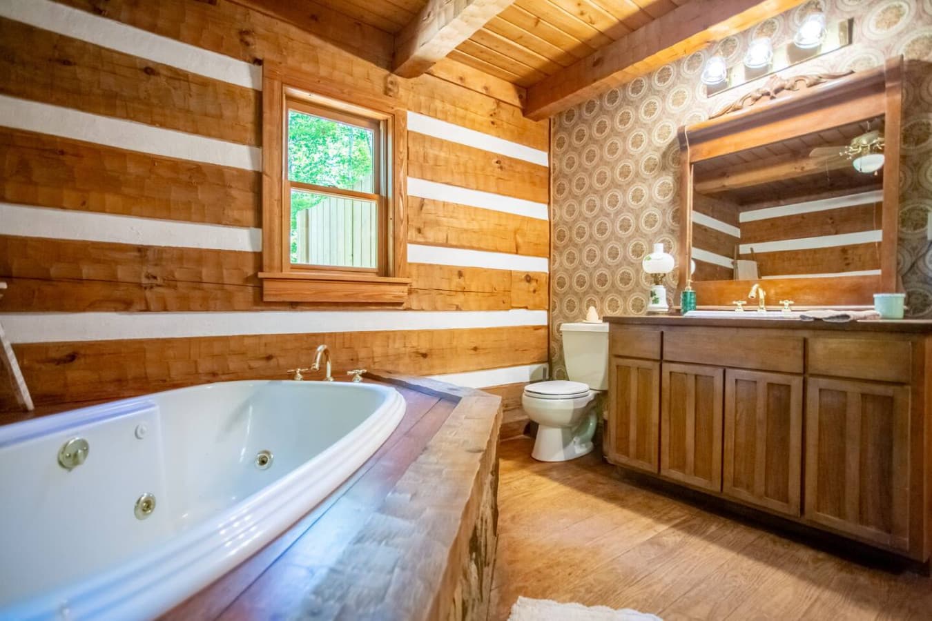 Your private oasis: cozy wood tones and a luxurious jetted tub.