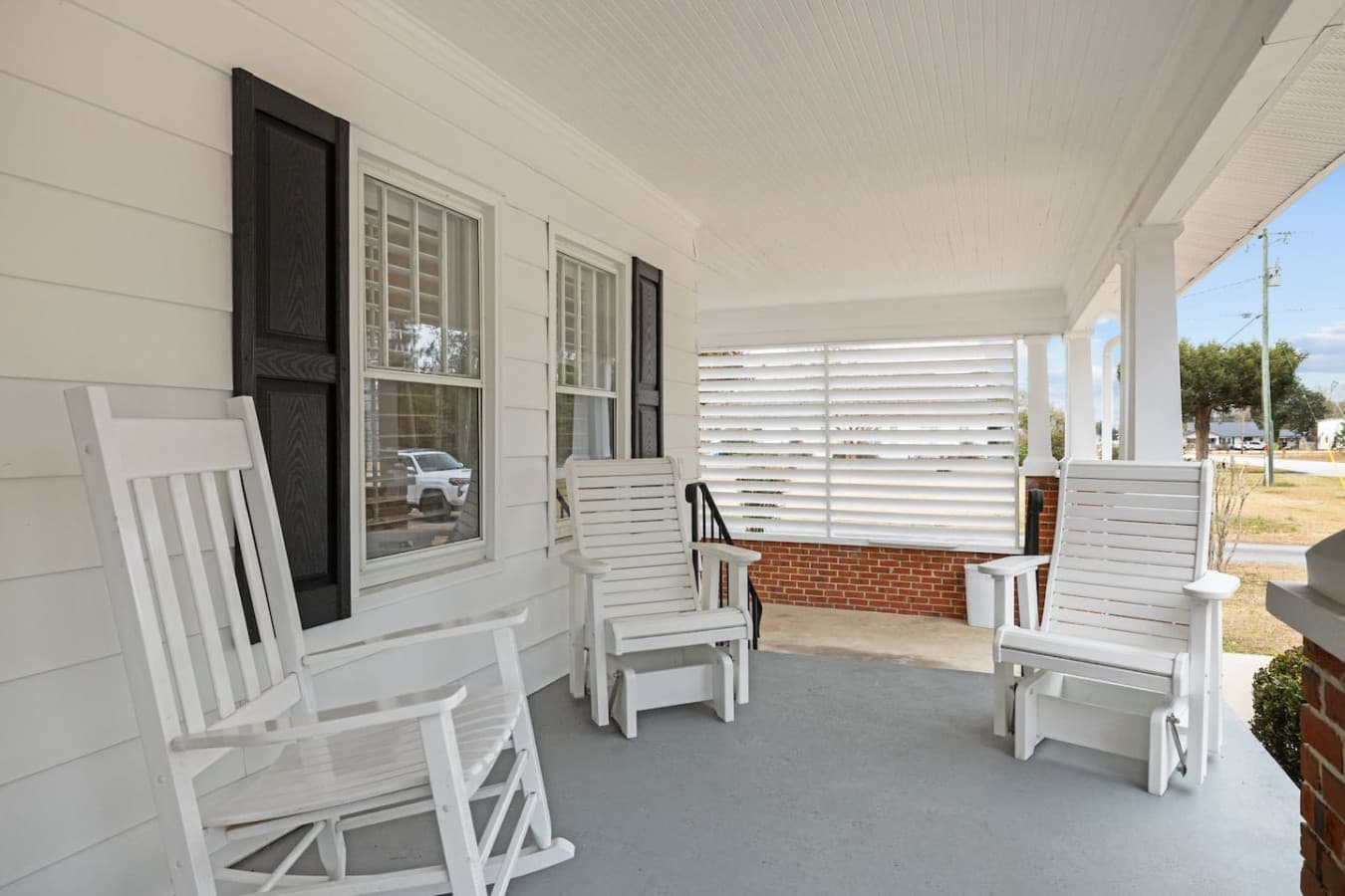 Sip your morning coffee, enjoy a peaceful evening, or soak in the fresh Carolina air on this cozy porch.