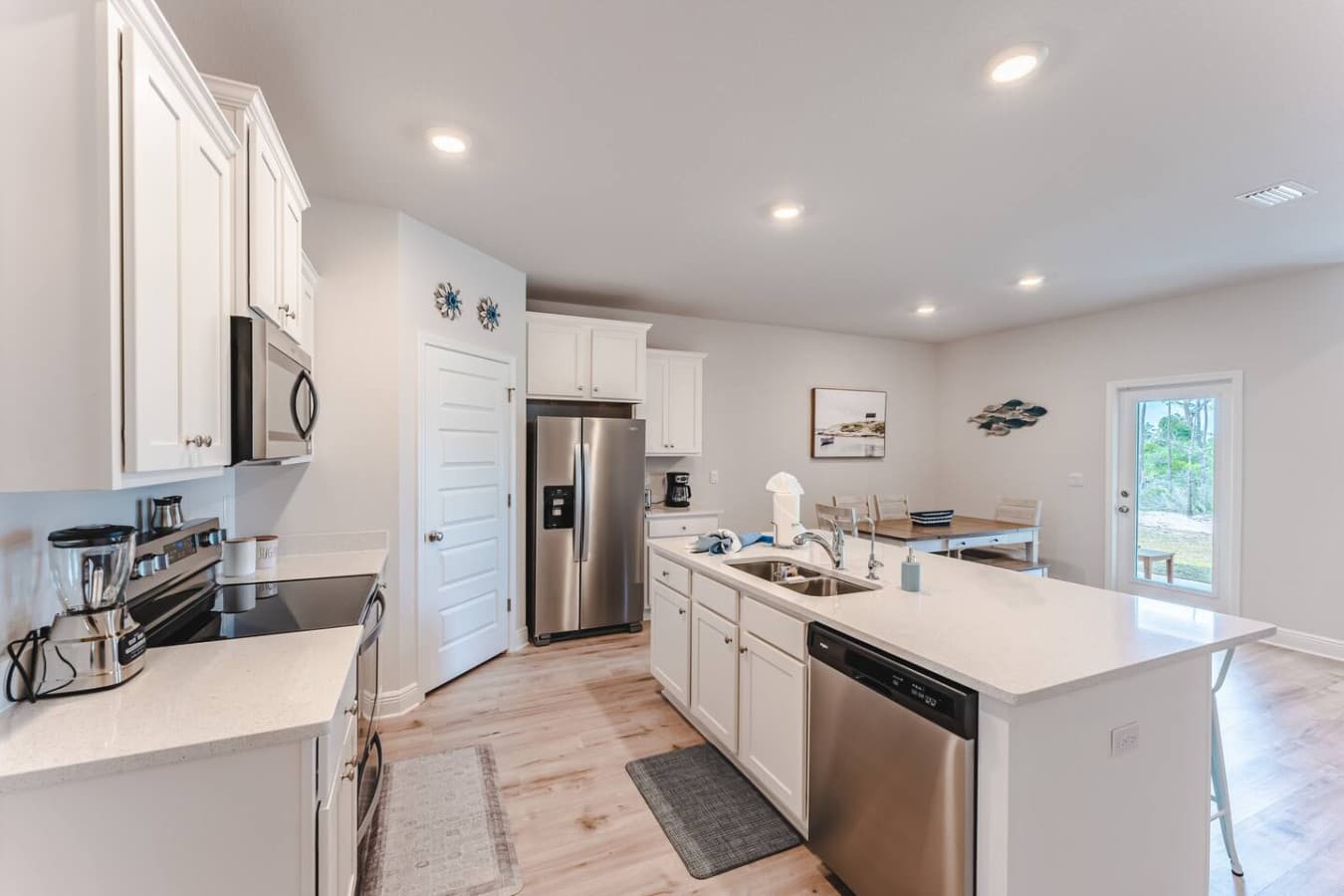 Kitchen with walk-in pantry stocked with essential items, Blender, Toaster, Coffee Maker.