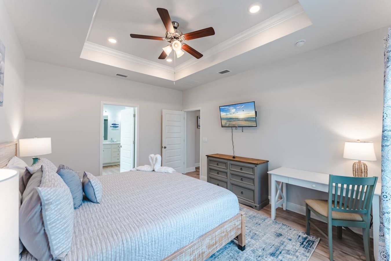 Unwind in our master bedroom featuring a king bed, smart tV, en-suite bathroom, and a dedicated work desk