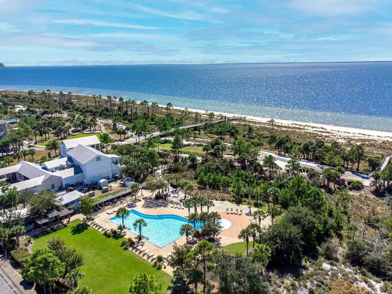 A view of the community, the pool, and the beautiful blue ocean