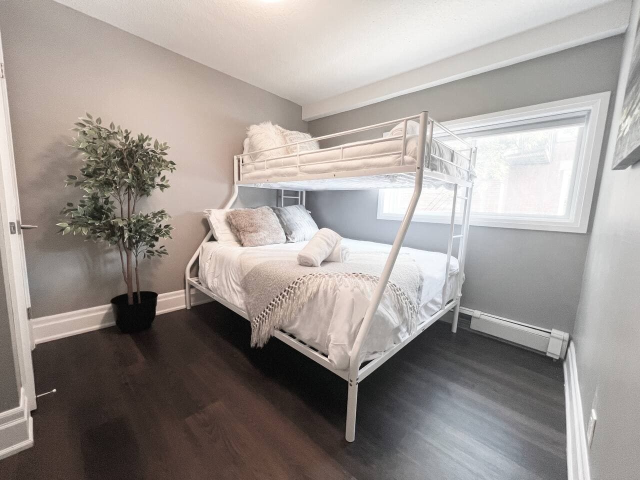 This bunk bed provides cozy comfort for friends or family.