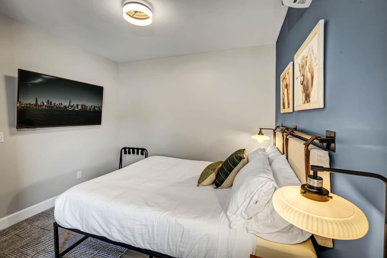 Master Bedroom - Queen Size with a big TV, perfect for Netflix and chill after a long day of adventure.