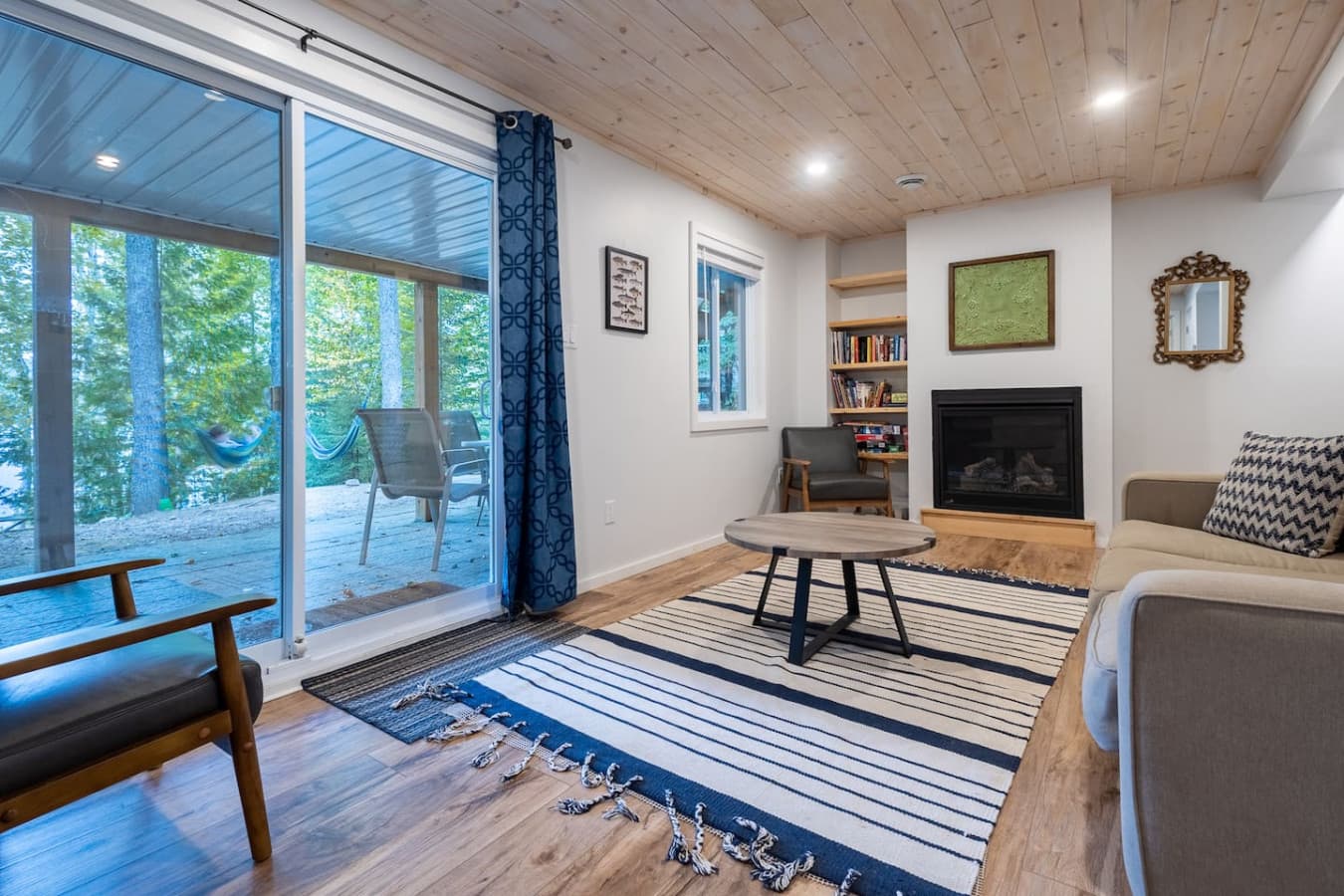 Enjoy lake and outdoor views from the den. The couch also converts into a pull-out for extra sleeping space.