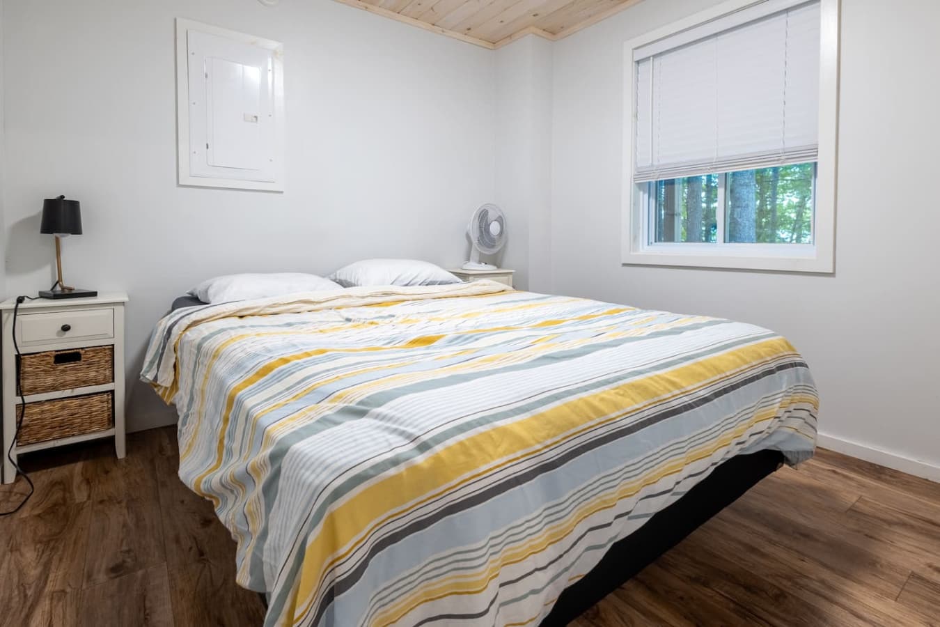 Soft linens and a peaceful ambiance—rest easy in this queen bed.