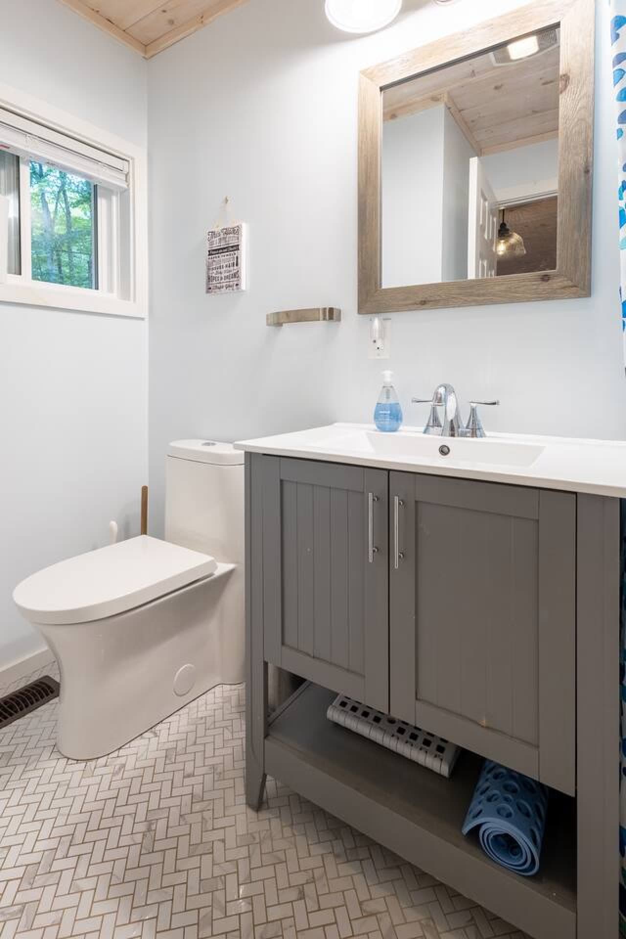 Clean, modern vanity space that makes even brushing your teeth feel a bit nicer.