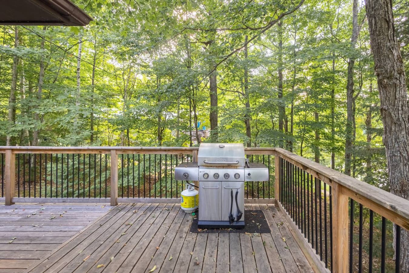 Enjoy cooking outdoors with a BBQ grill right on the deck.