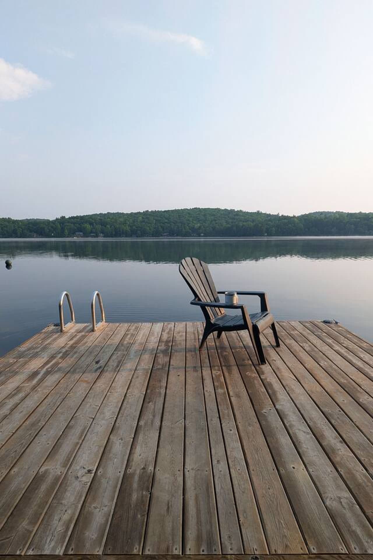 Lakeside seating with Adirondack chair designed for enjoying the view.