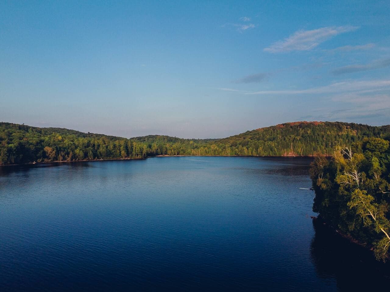 Peaceful lake views stretching out under open skies.