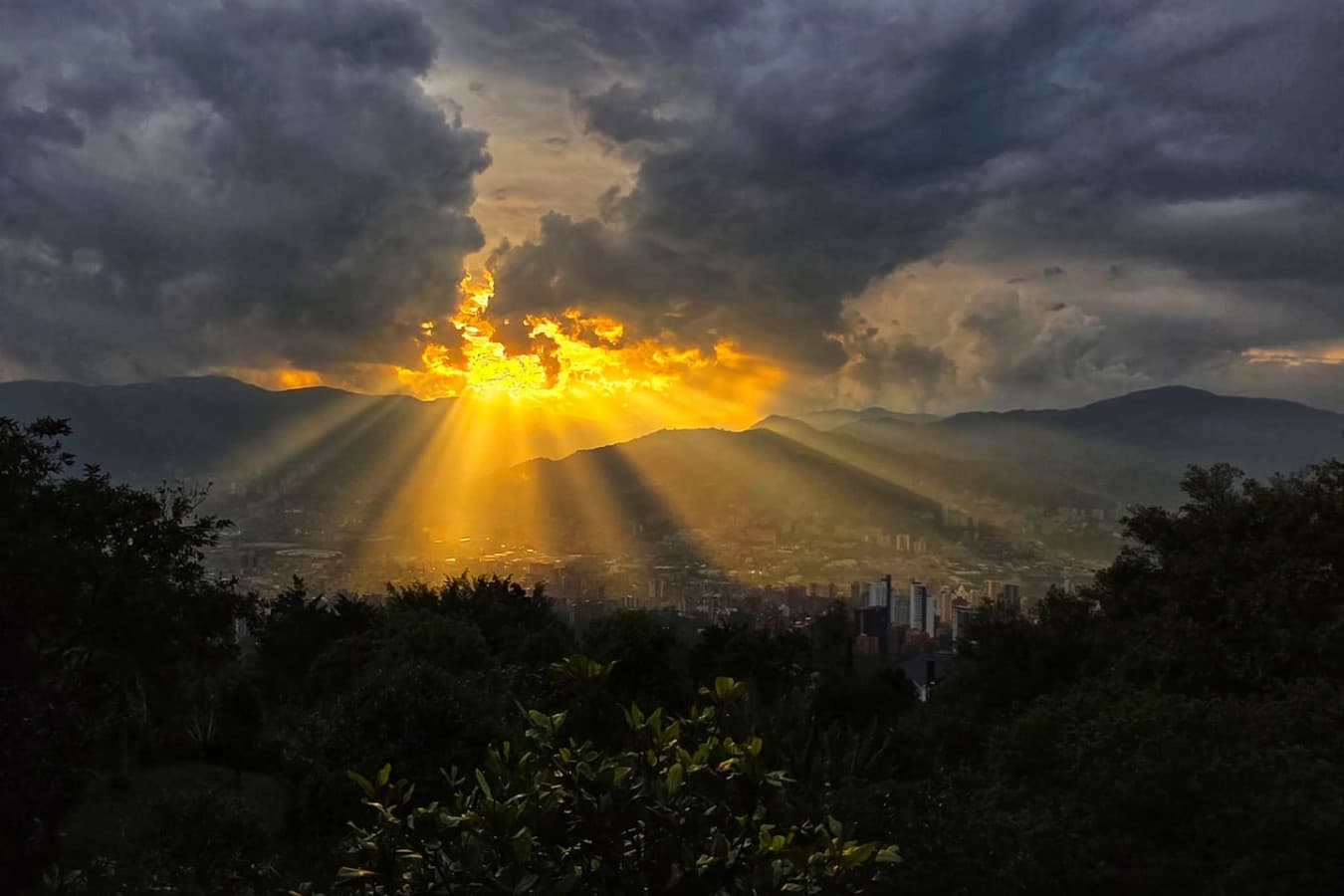 Front-row seats to Medellín’s sunsets, where vibrant skies meet twinkling city lights.