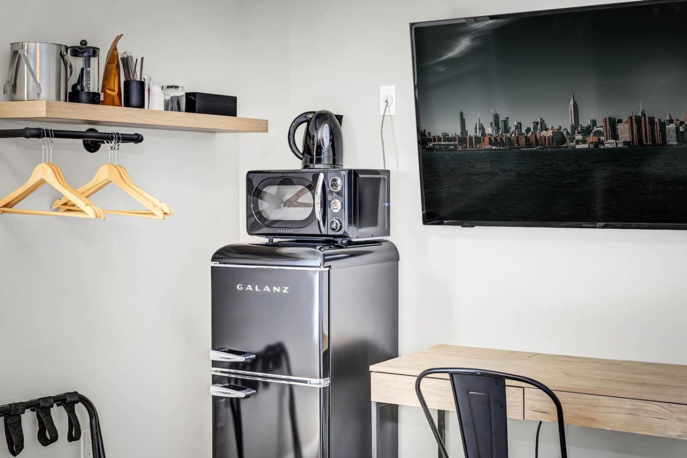 A functional space featuring kitchen appliances for added convenience in the bedroom.