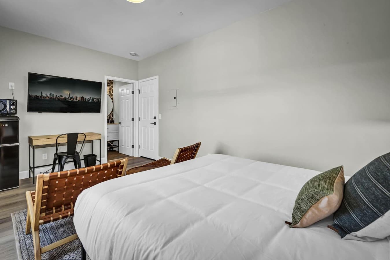 Spacious modern bedroom, convenient for comfort and relaxation.