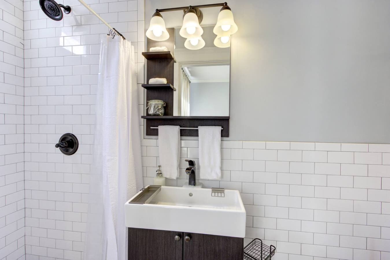 Fully redone bathroom, complete with  sink and a mirror for quick touch-ups!