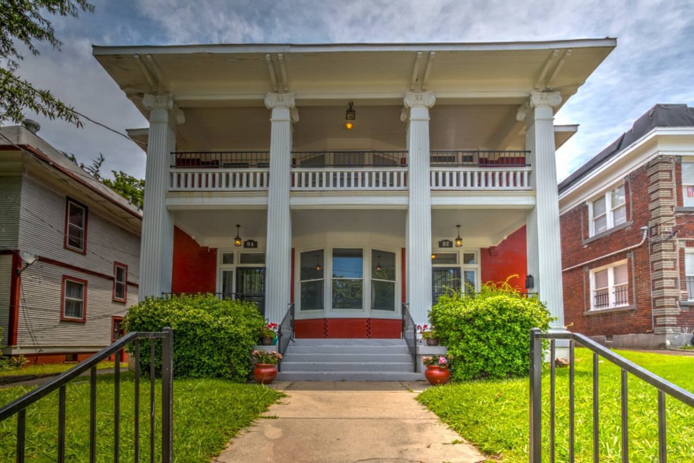 Street view of the building — your apartment is downstairs with the left entry door.