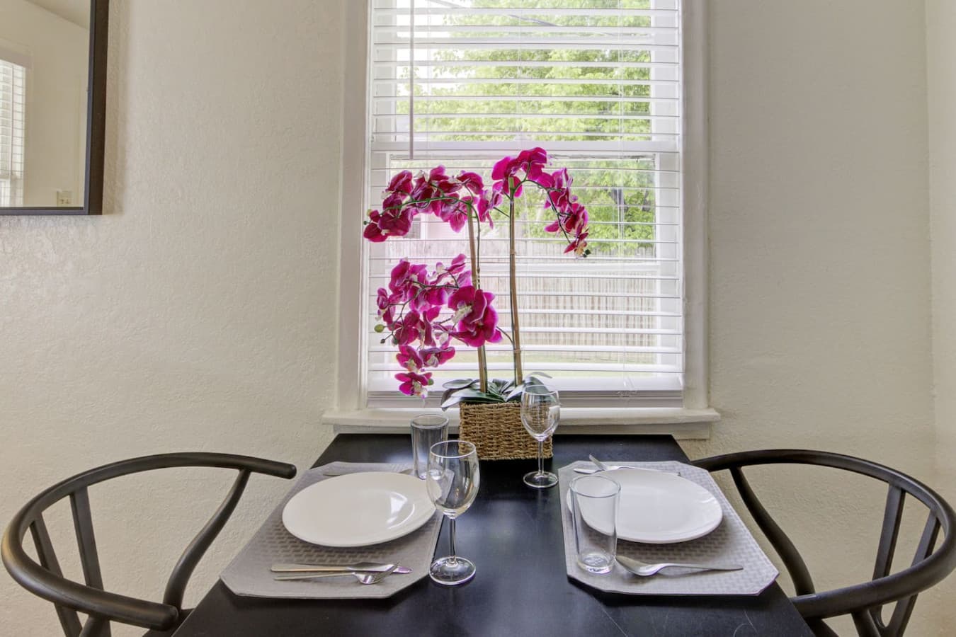 Two chairs, endless possibilities—your intimate dining spot.