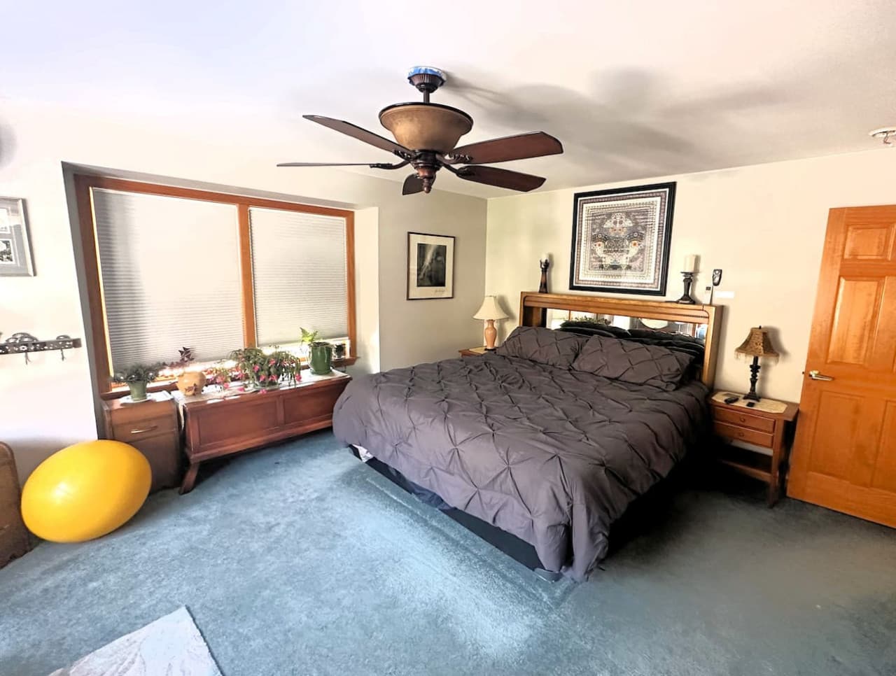 Spacious primary suite featuring a plush king bed and fresh, crisp linens.