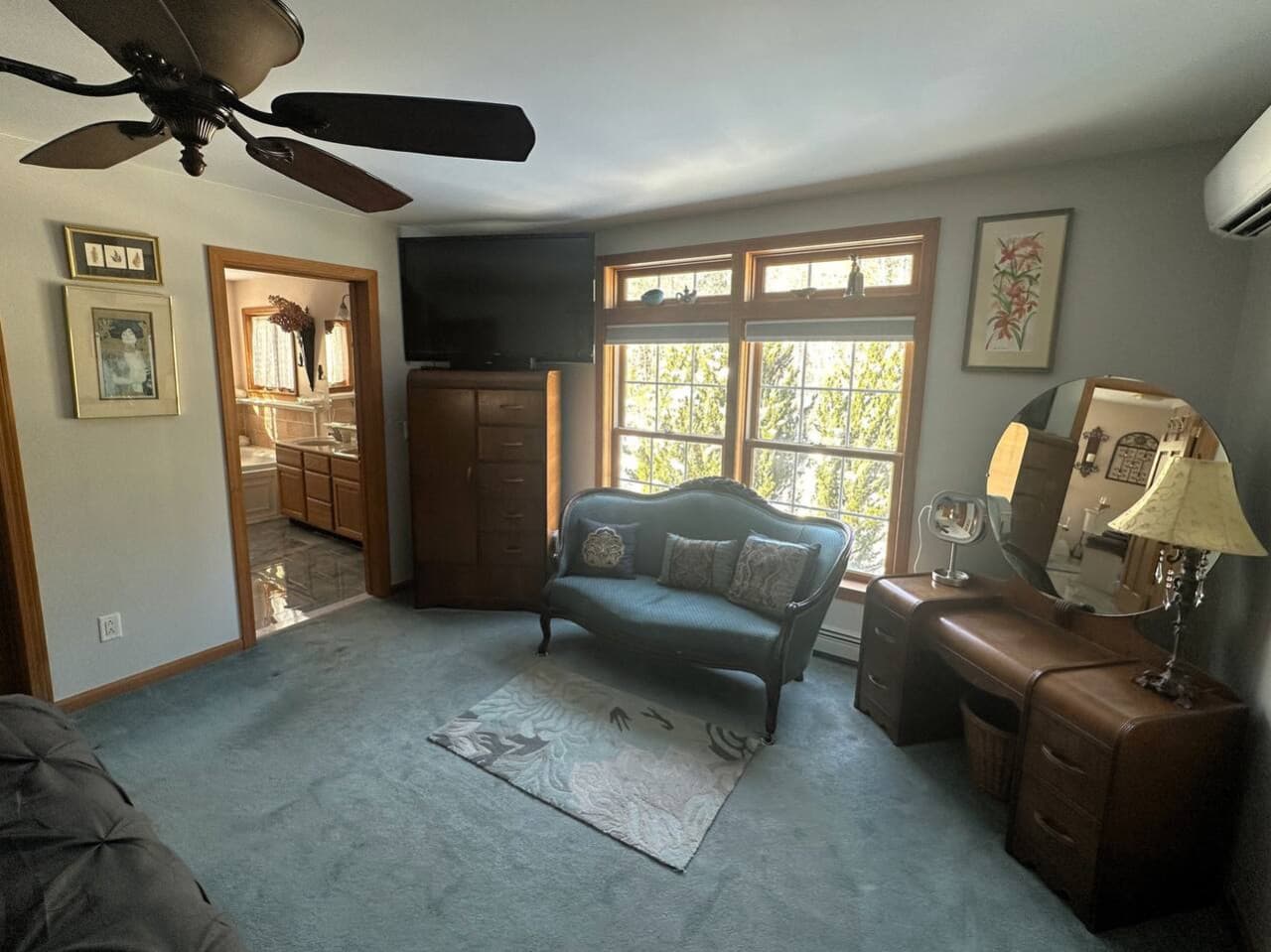 Bright and airy master retreat with ceiling fan for added comfort.
