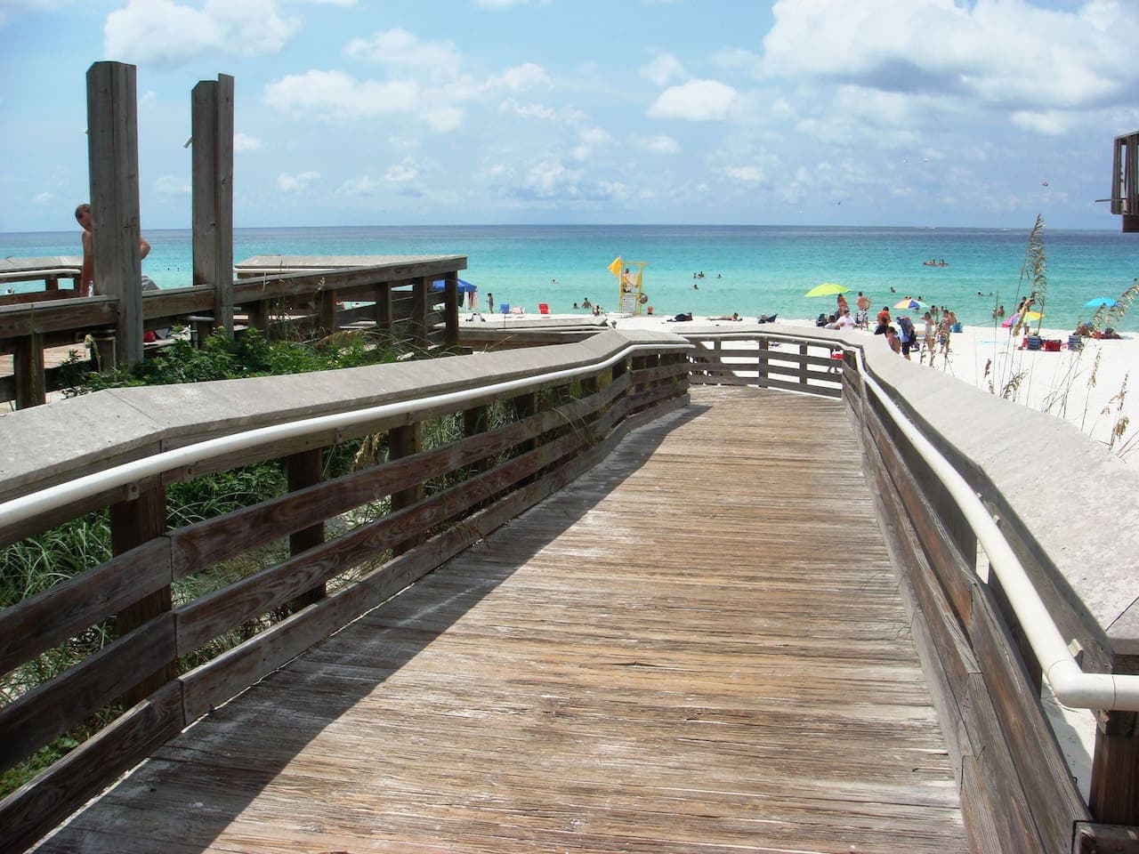 Walk into paradise and experience the stunning beauty of June White Decker Beach, where crystal-clear waters and pristine sands invite families to enjoy a perfect getaway.