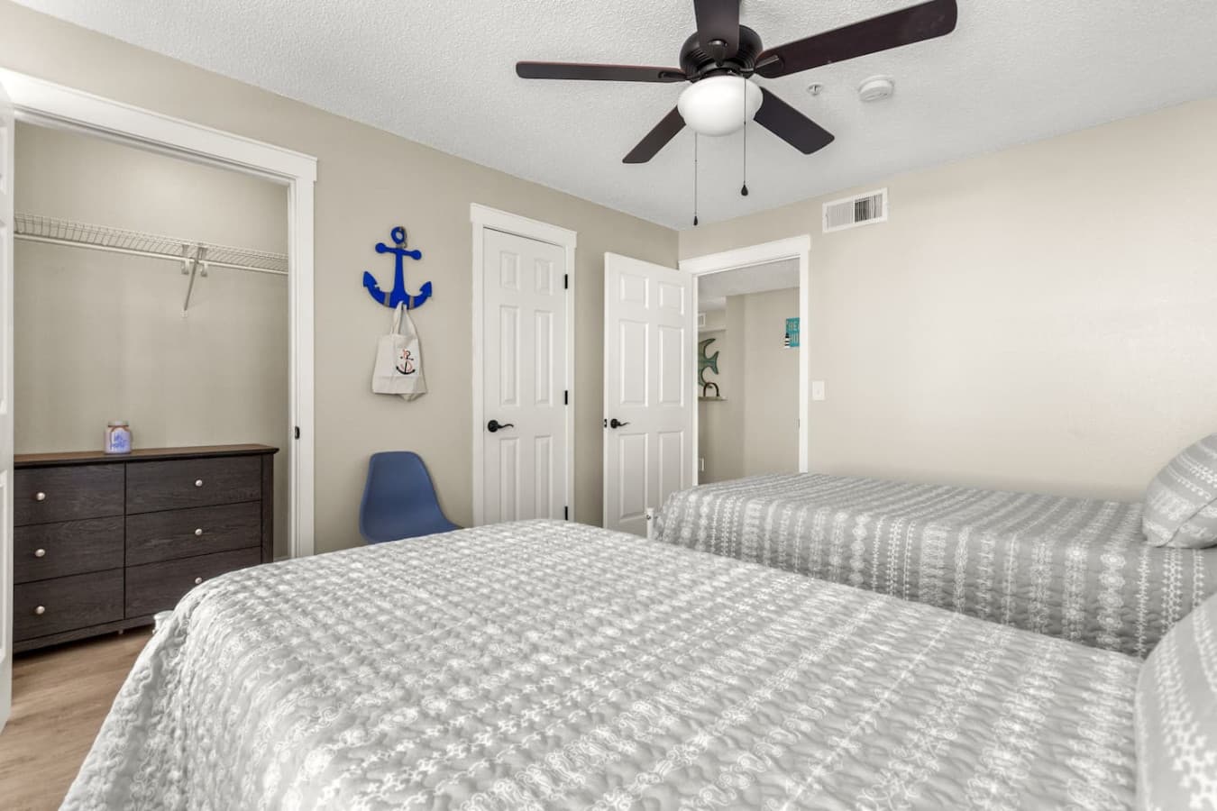 This spacious room with two double beds offers plenty of comfort and room to relax.