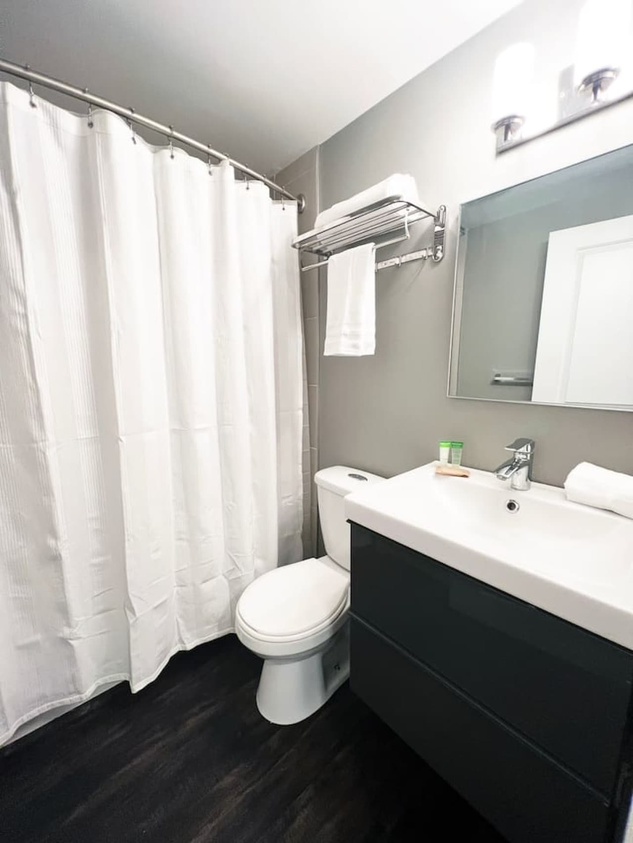 Indulge in relaxation in our modern, well-appointed bathroom.