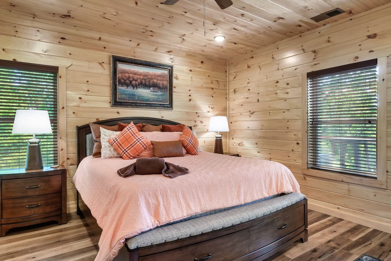 A King-Sized Comfort Zone – Soft linens, warm wood accents, and a king bed built for restful nights.