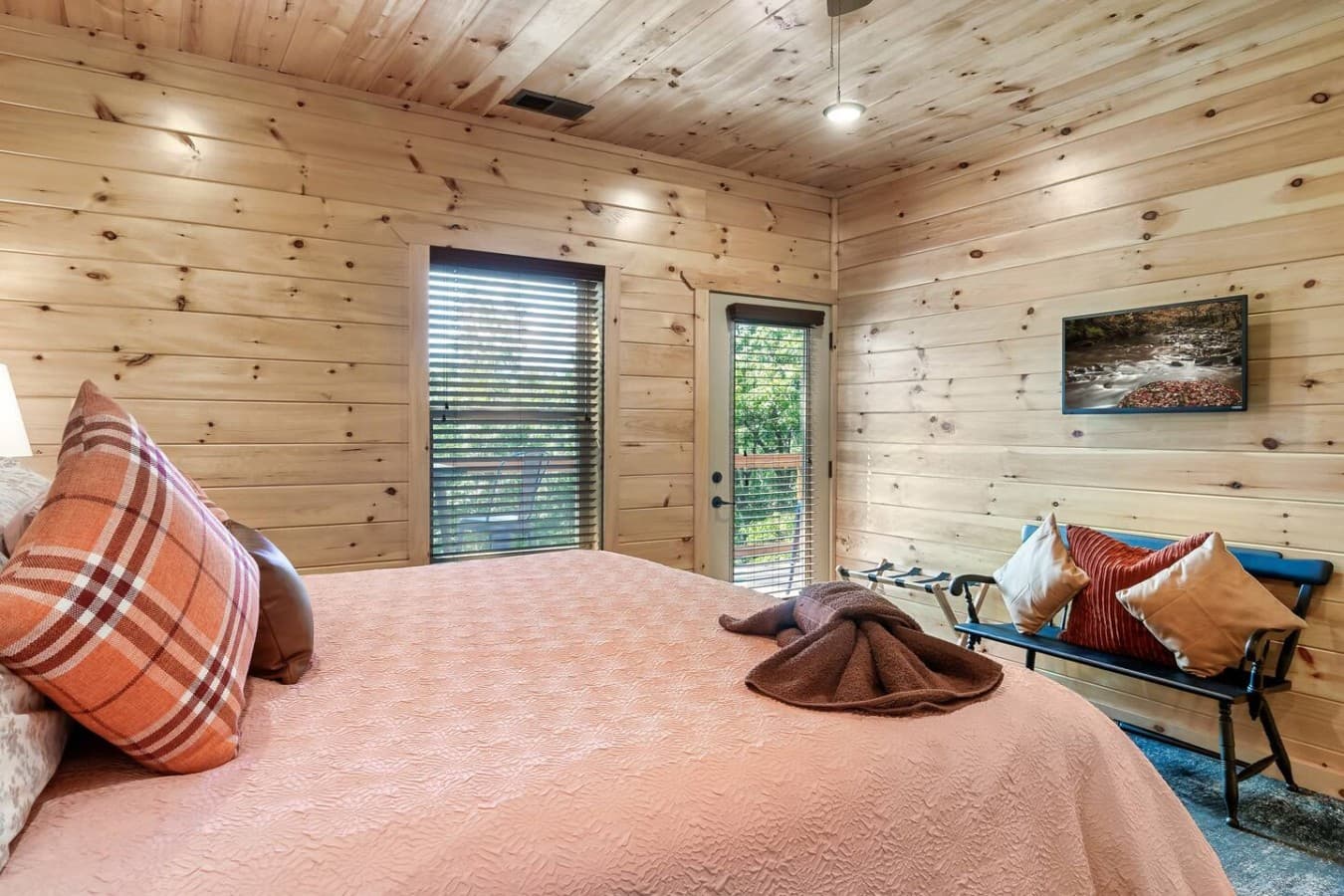 Sleep Like a Log (Cabin) – This king bed is as dreamy as the mountain views outside.