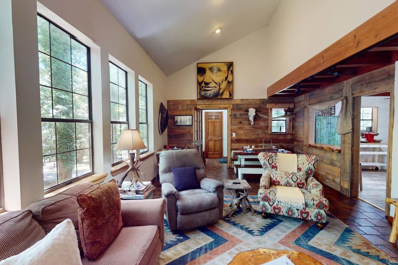 Living room with large windows & an abundance of natural light and views of wildlife.