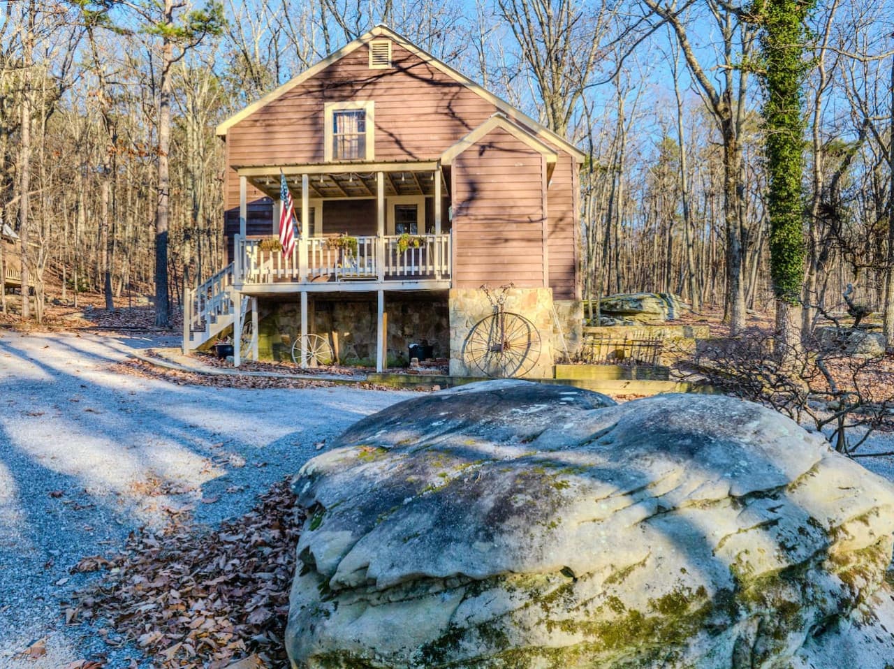 Front of Rock Haven with one of the many unique and beautiful boulders that landscape the property.