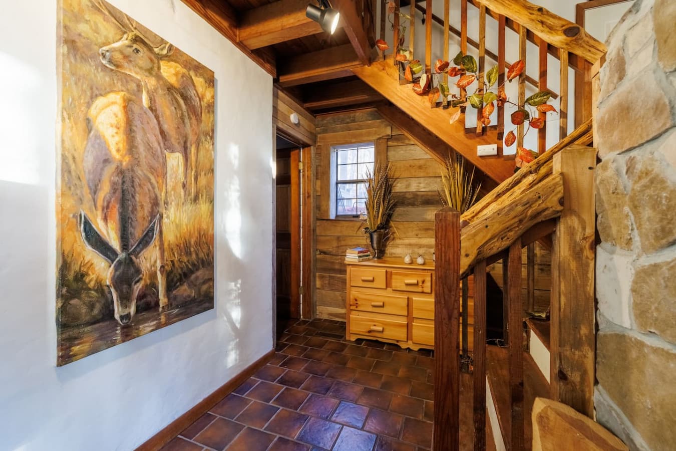 Stairs to the second bedroom and breezeway and back door to porch.