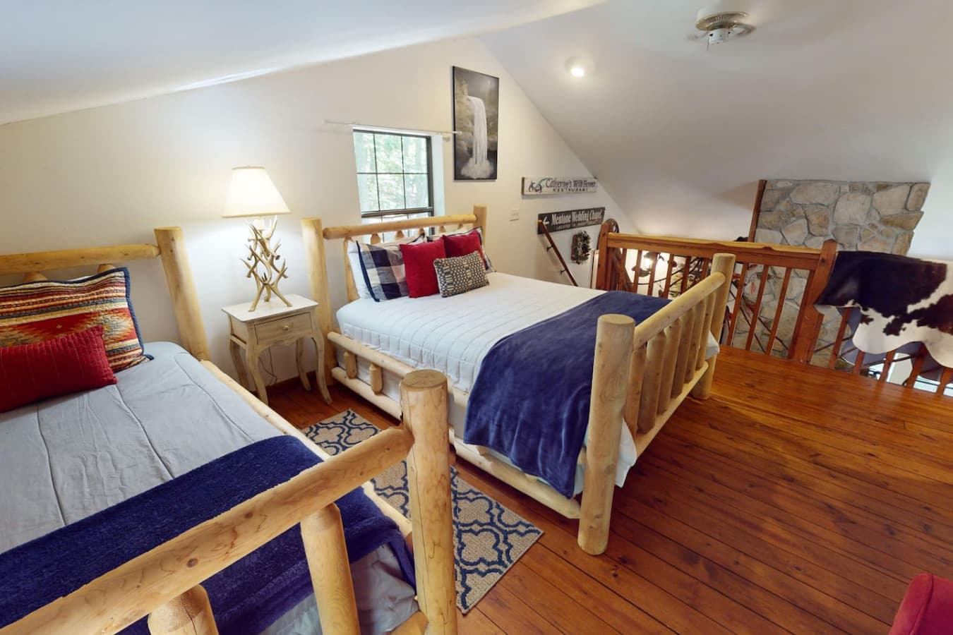 Upstairs charming loft bedroom with 2 queen beds.