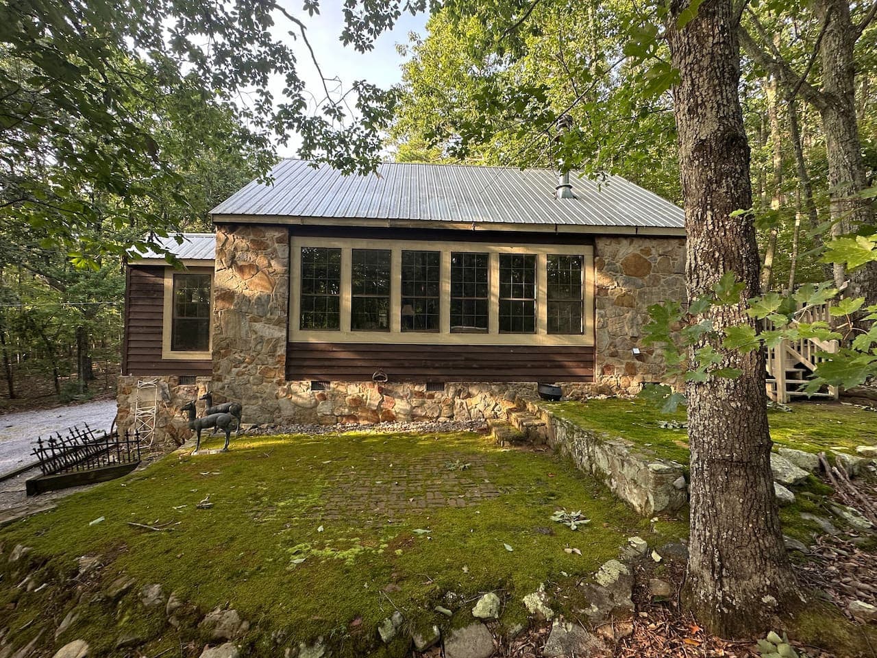 Beautiful historic Mentone rock home with mossy side yard.