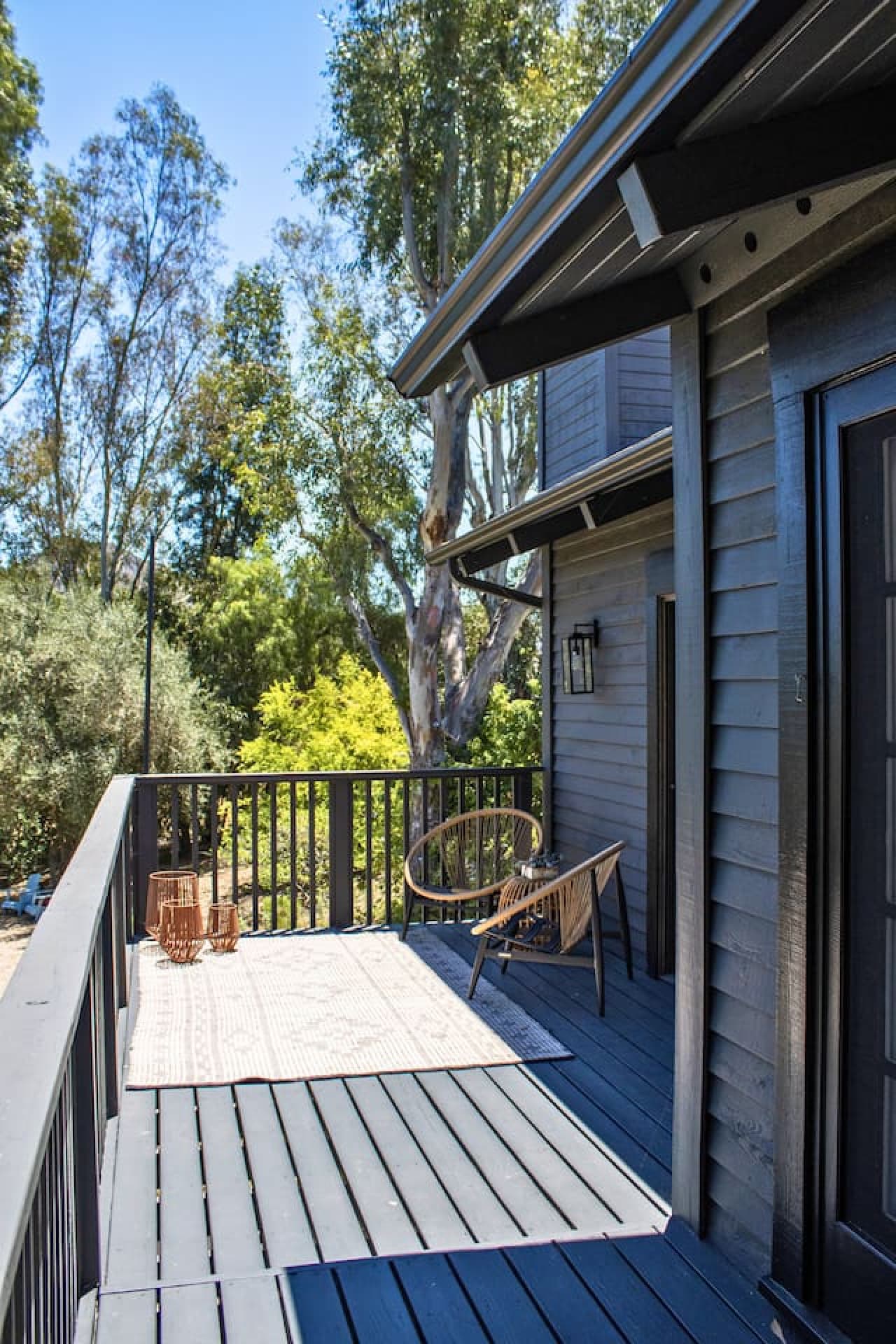 Spacious deck perfect for outdoor dining and enjoying stunning lake views in a serene setting.