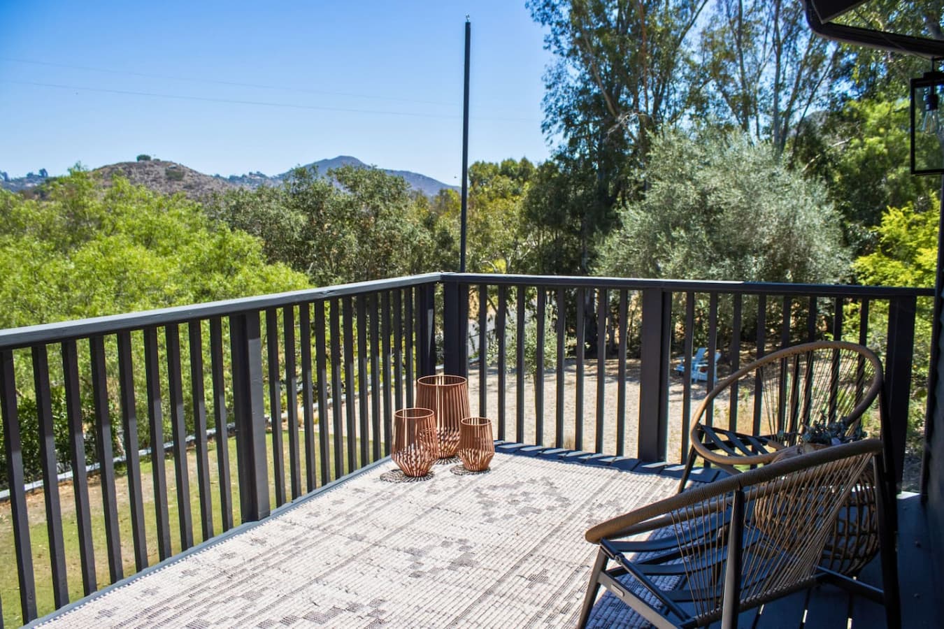 Spacious deck perfect for outdoor dining and enjoying stunning lake views in a serene setting.