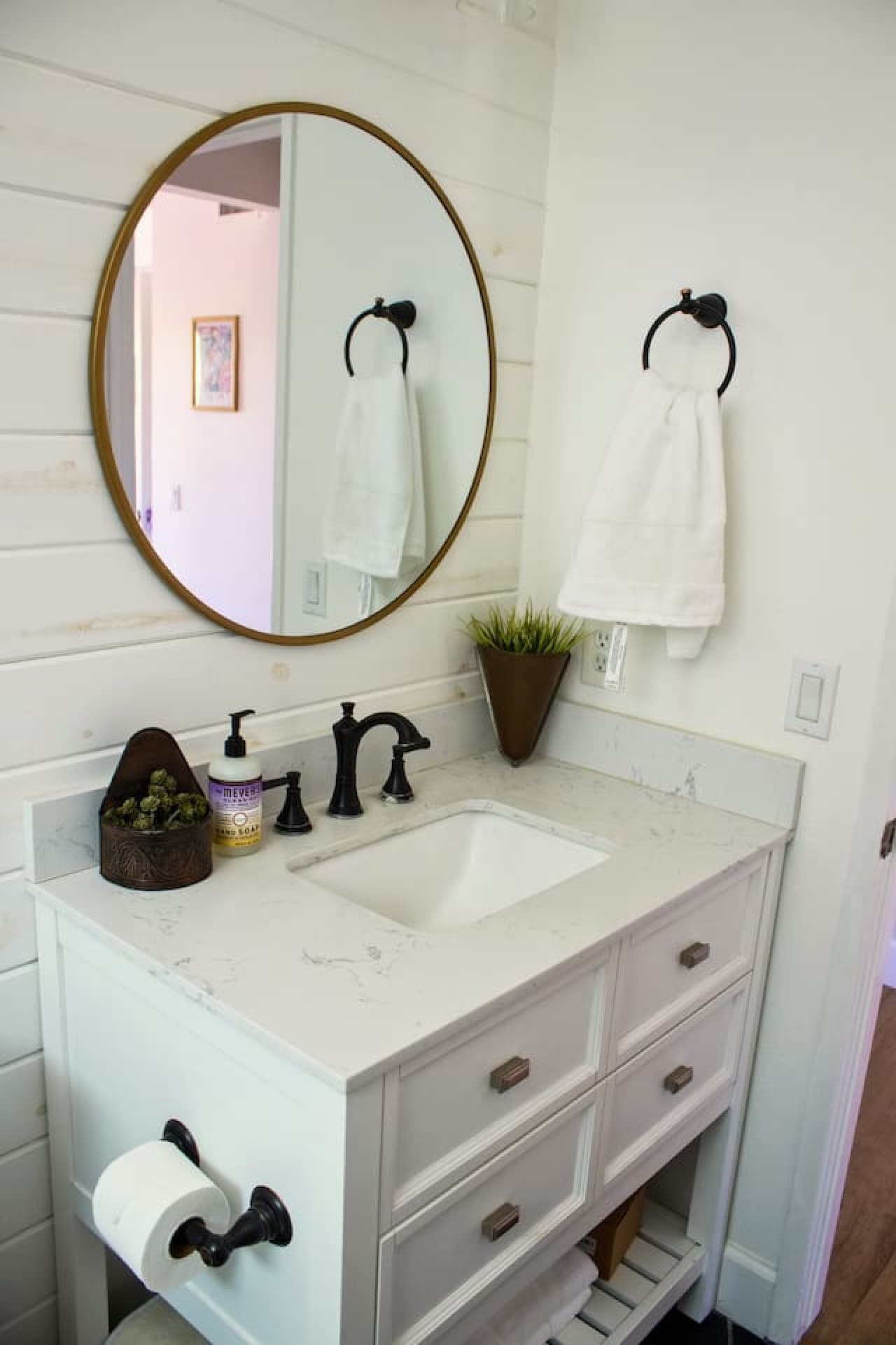 Second bathroom with a shower/tub combo, sleek vanity, and modern fixtures, providing comfort and convenience for guests.