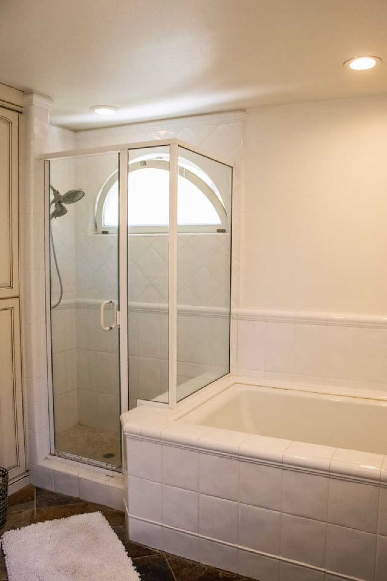 Master bathroom featuring a spacious shower, a separate bath tub, modern vanity, and plenty of storage, offering a serene space to refresh and relax.