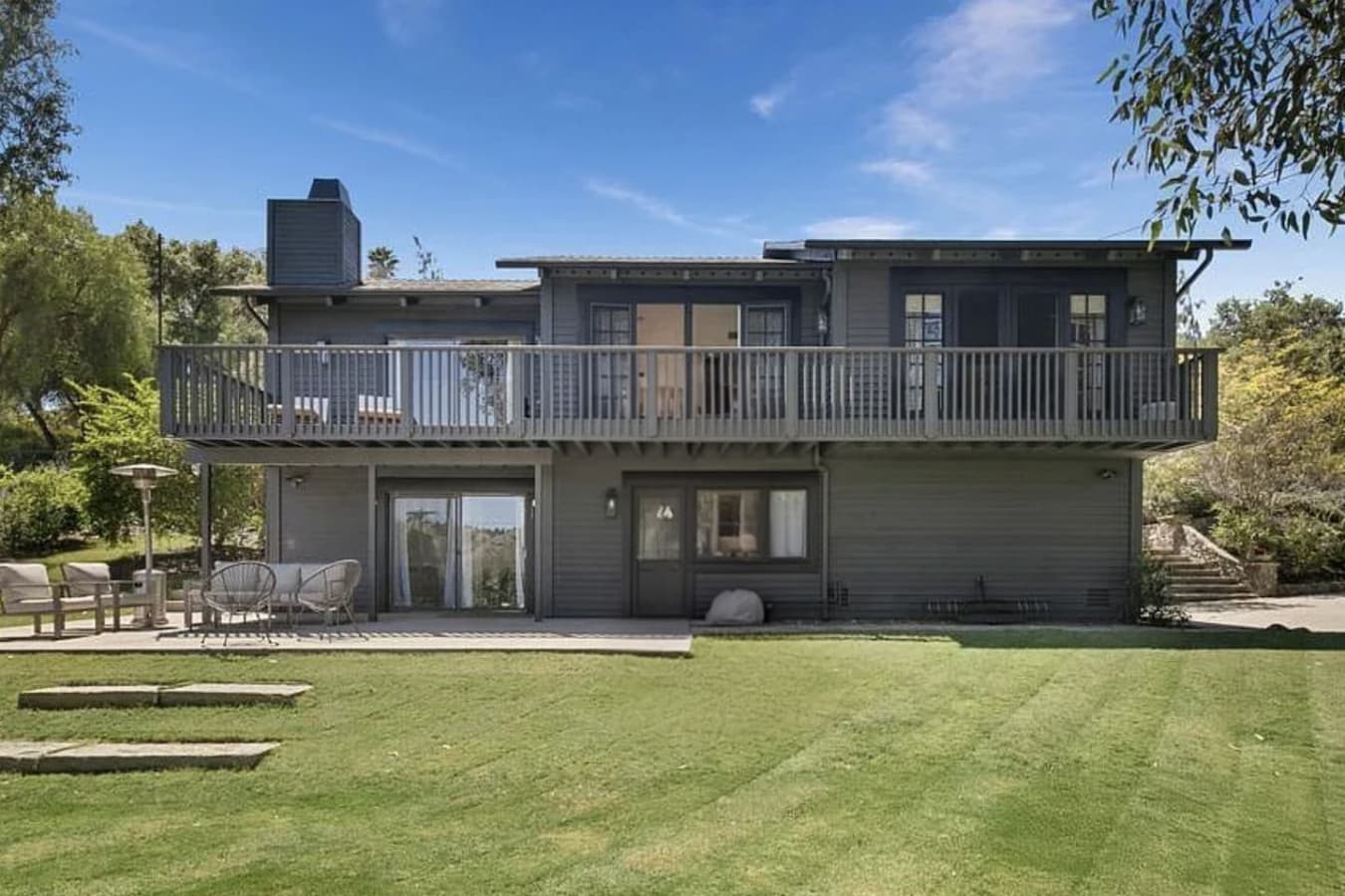 View of the home from the expansive front yard. Fully-fenced!