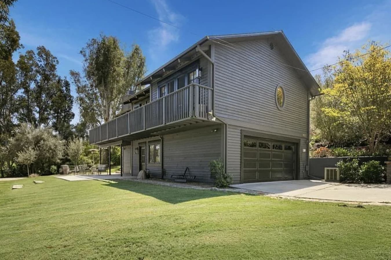View of the home from the expansive front yard. Fully-fenced!