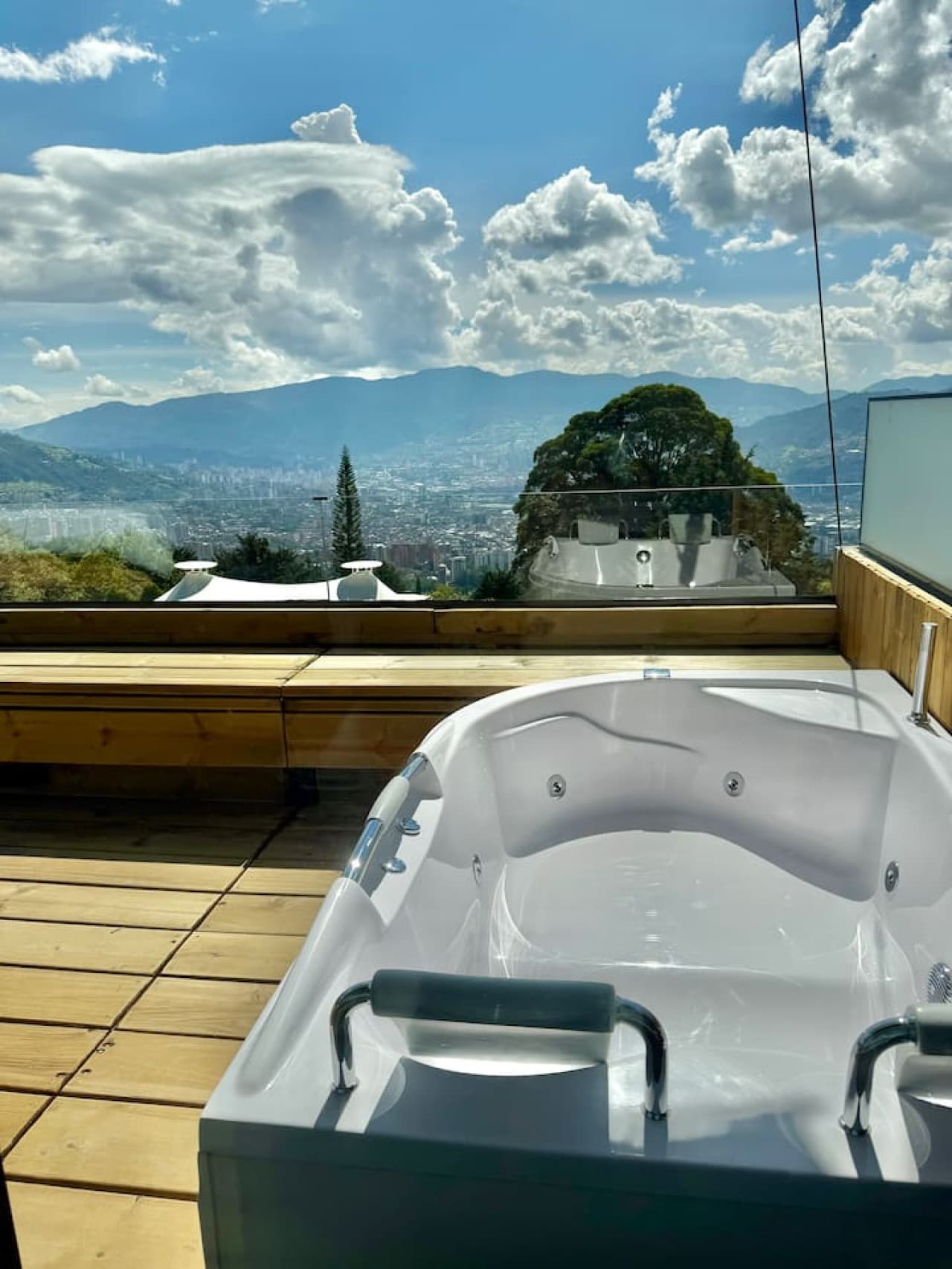 Enjoy a peaceful soak surrounded by nature with panoramic views all around.