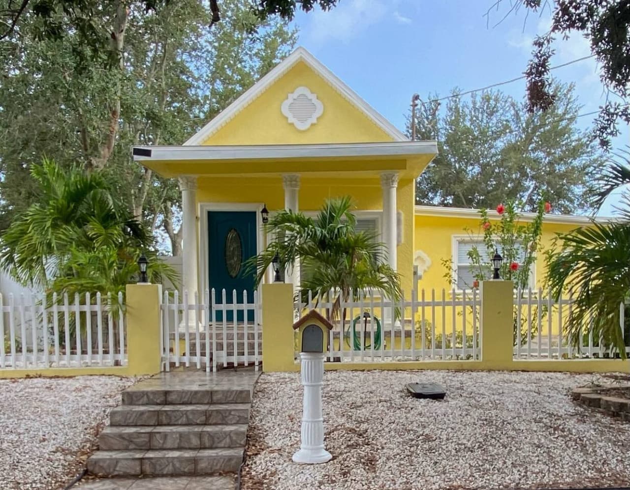 Warning: staring at this cheerful yellow house may cause sudden happiness.