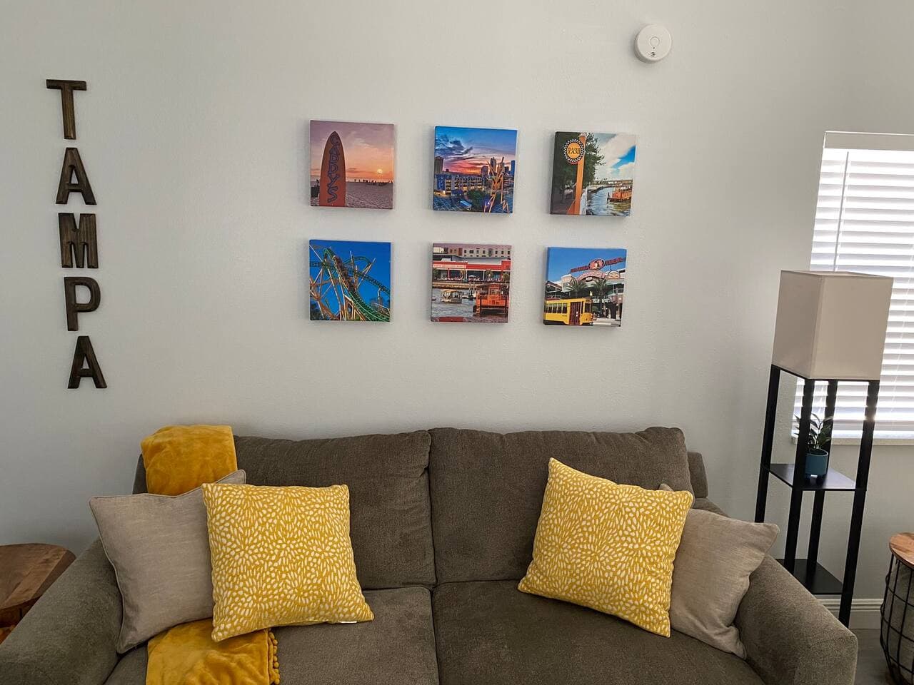 Sink into the comfy sofa and soak in the colorful Tampa-inspired touches around you.